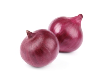 Photo of Fresh whole red onions on white background