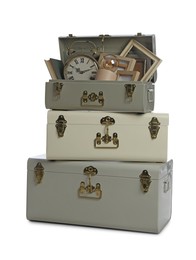 Photo of Stylish storage trunks with different interior elements on white background