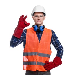 Photo of Young man wearing safety equipment and showing ok gesture on white background