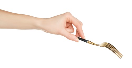 Photo of Woman holding shiny golden fork on white background, closeup