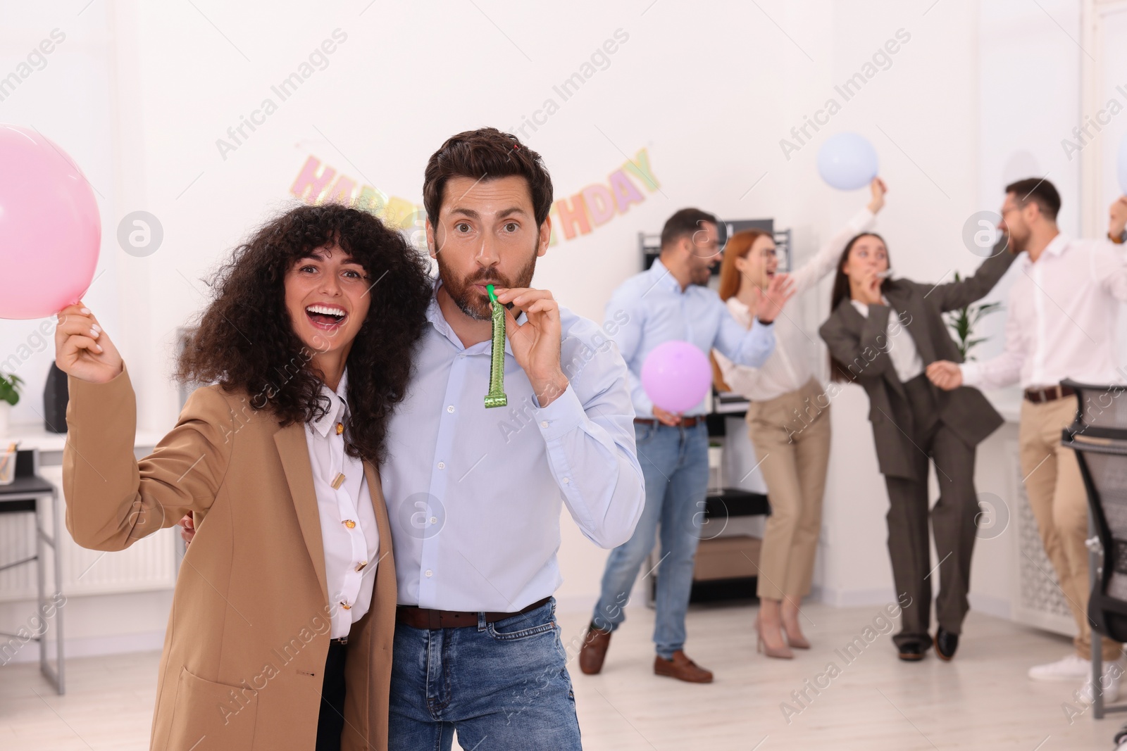 Photo of Coworkers having fun during office party indoors, space for text