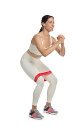 Photo of Woman doing squats with fitness elastic band on white background