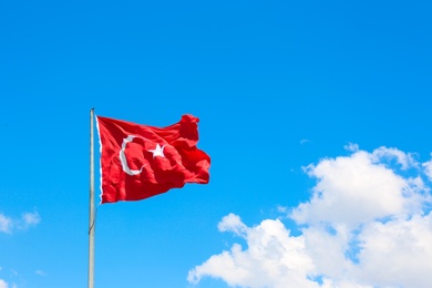 Turkish flag fluttering on blue sky background