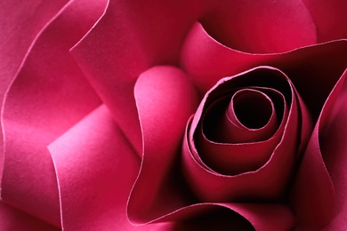 Photo of Beautiful red flower made of paper as background, closeup