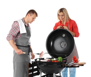 Photo of Happy couple cooking on barbecue grill, white background