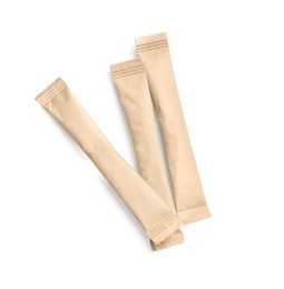 Photo of Beige sticks of sugar on white background, top view