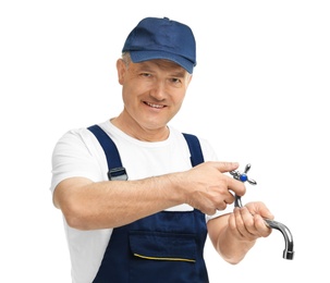 Mature plumber with faucet on white background