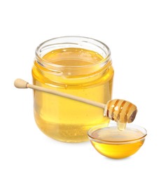 Natural honey dripping from dipper into glass bowl. Jar full of honey on white background