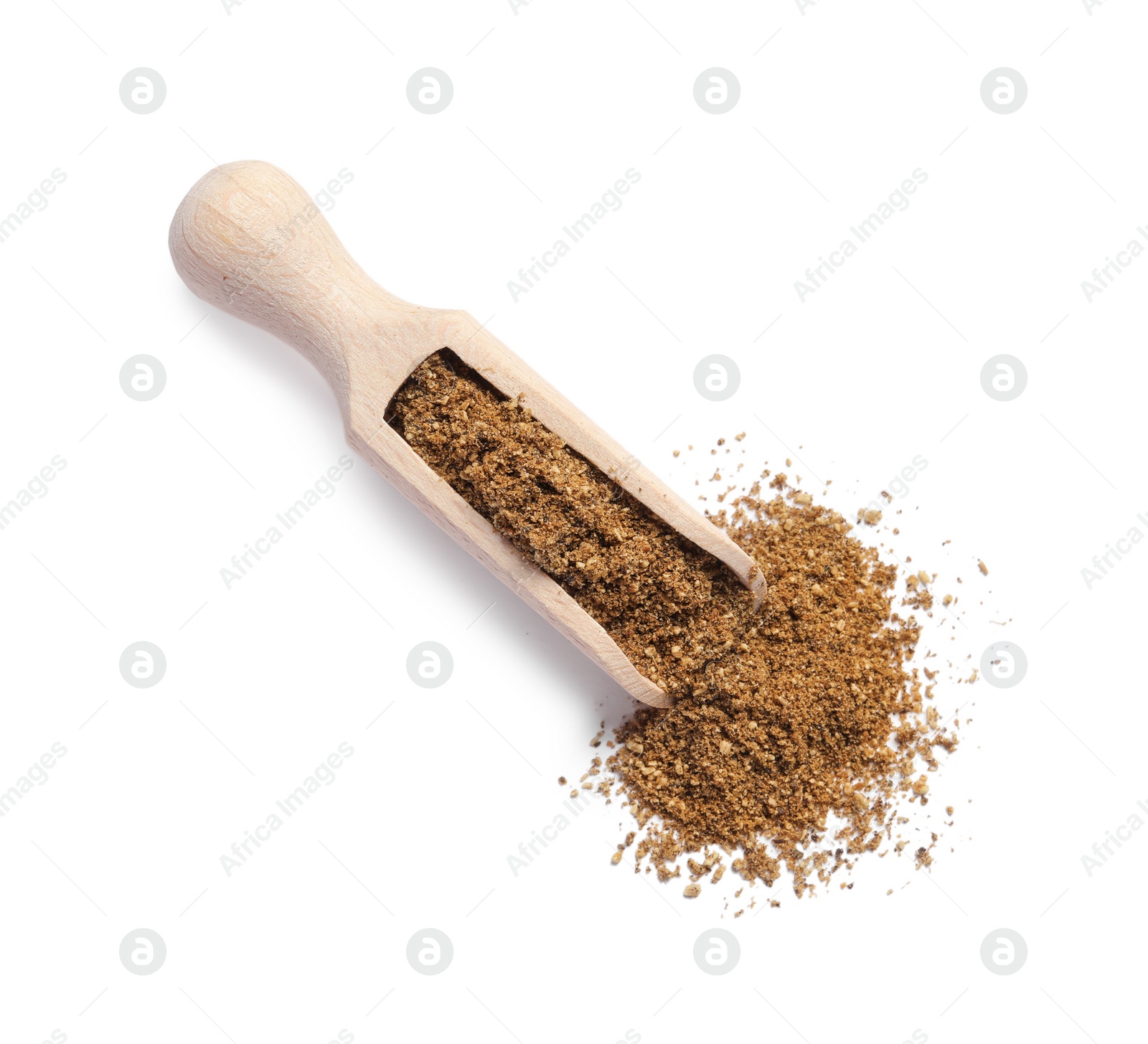 Photo of Wooden scoop of aromatic caraway (Persian cumin) powder isolated on white, top view