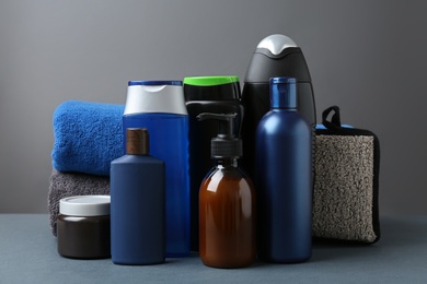 Photo of Set with men's personal hygiene products on grey table