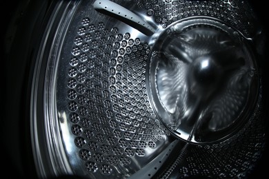 Empty washing machine drum, closeup. Laundry day