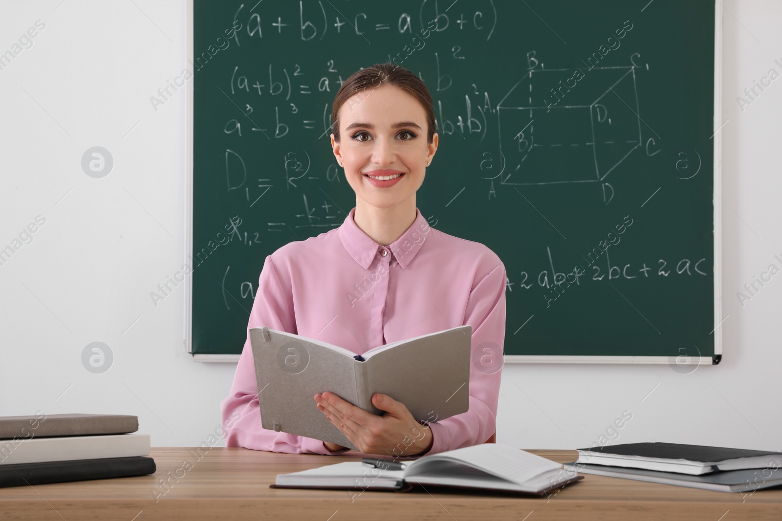 Photo of Portrait of young female teacher in classroom