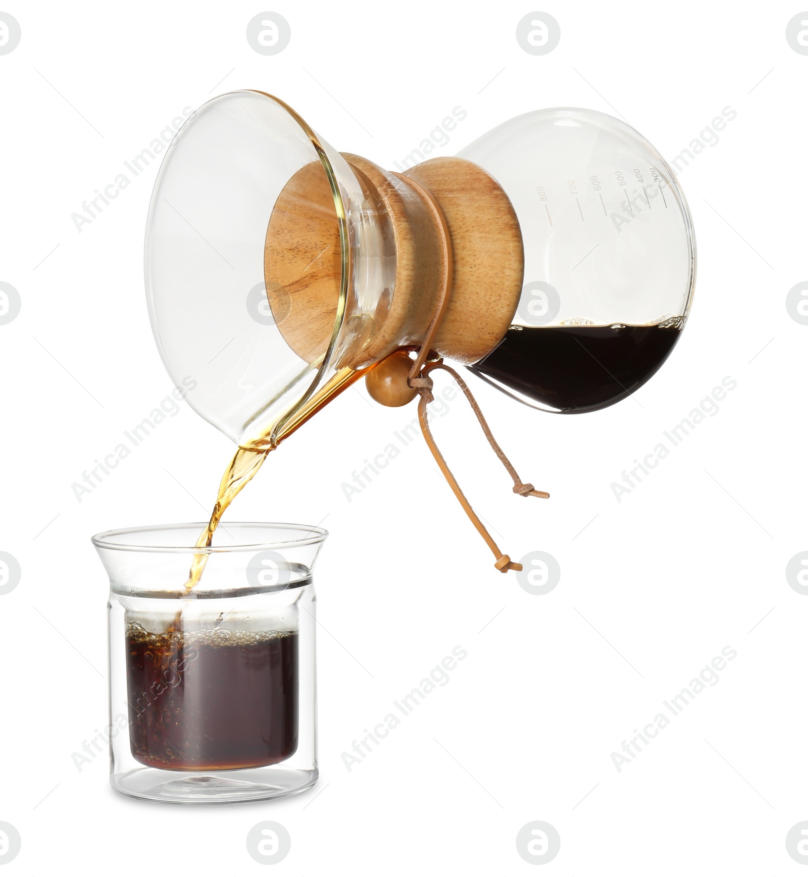 Photo of Pouring coffee from chemex coffeemaker into glass isolated on white