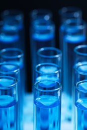 Photo of Test tubes with blue reagents, closeup. Laboratory analysis