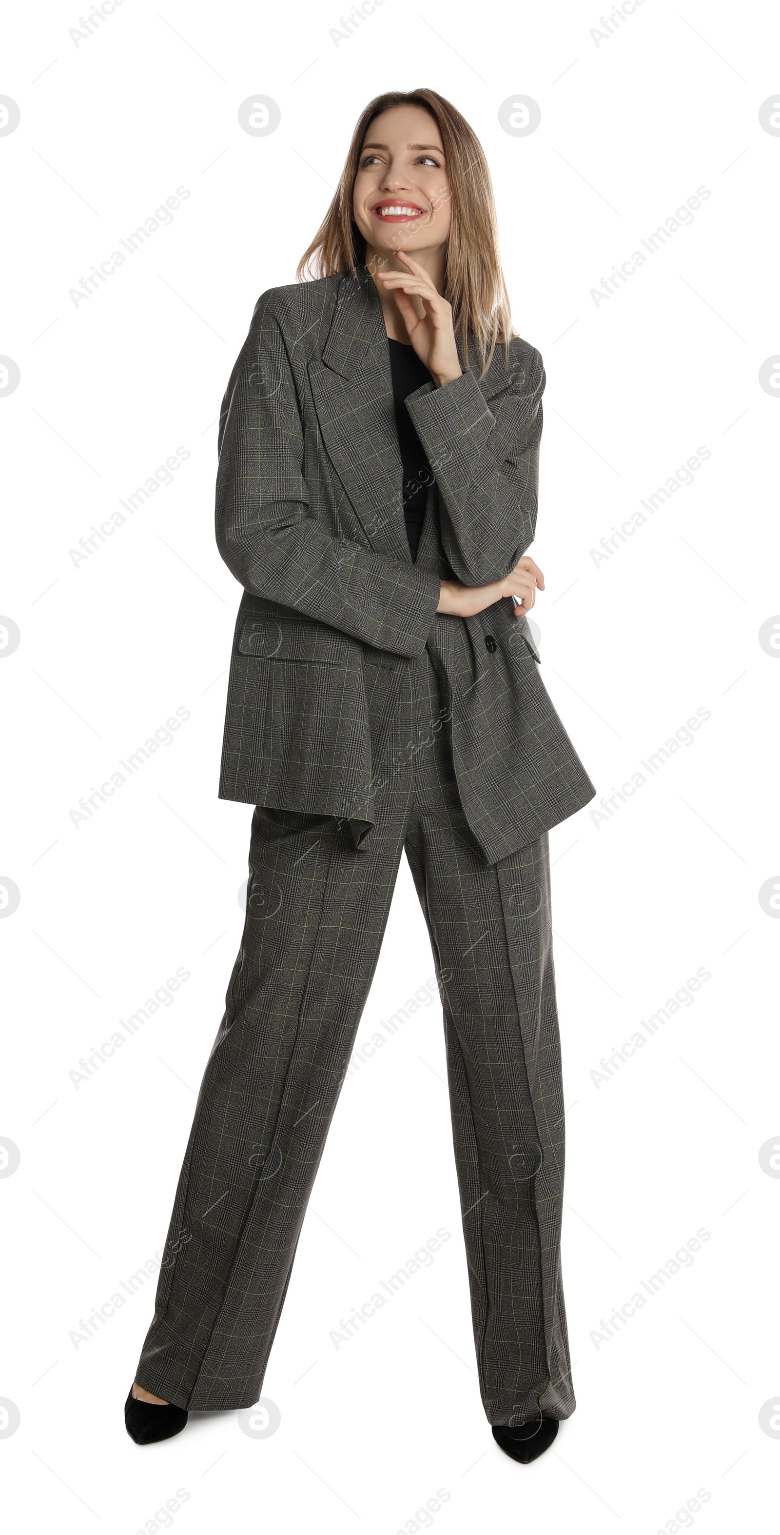 Photo of Full length portrait of beautiful young woman in fashionable suit on white background. Business attire