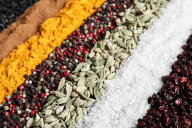 Photo of Many different spices as background, closeup view