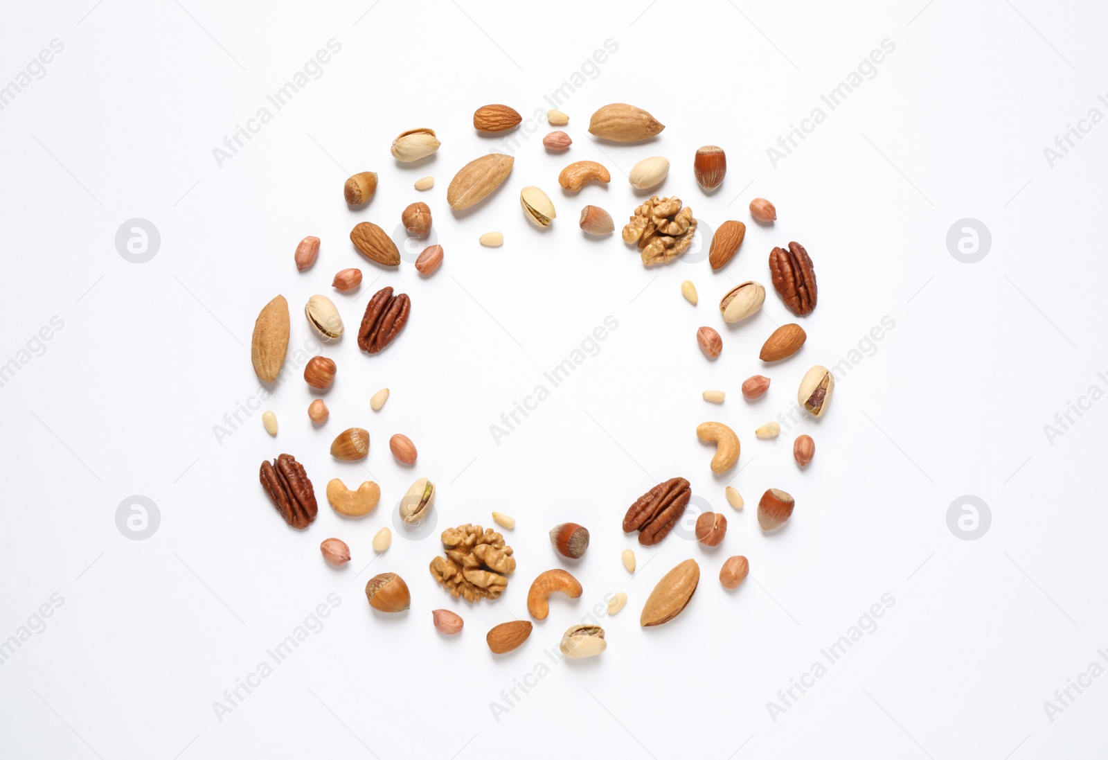 Photo of Different delicious nuts on white background, flat lay