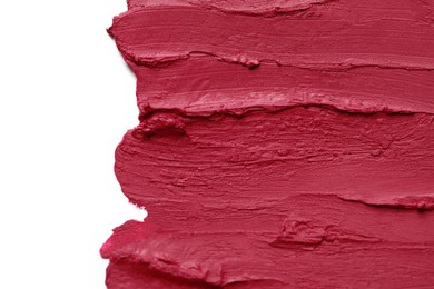 Photo of Smears of beautiful lipstick on white background, top view