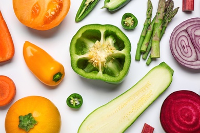 Different fresh vegetables on white background, top view