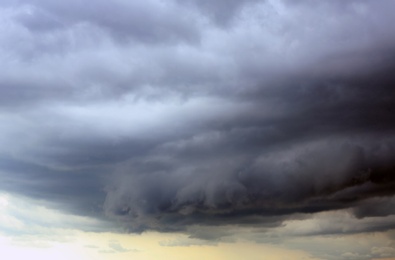 Sky with heavy rainy clouds on grey day