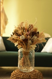 Bouquet of dry flowers and leaves in living room