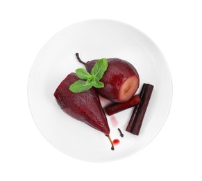 Photo of Tasty red wine poached pears with mint and cinnamon isolated on white, top view