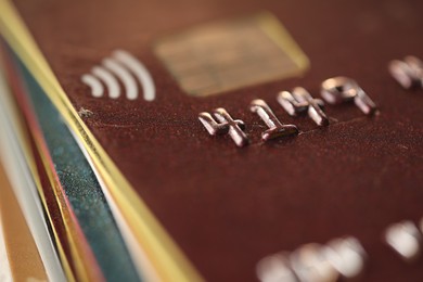 Different plastic credit cards as background, macro view