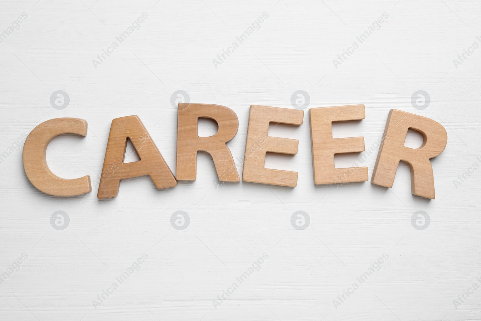 Photo of Word CAREER made with wooden letters on white background, flat lay