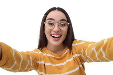 Photo of Smiling young woman taking selfie on white background