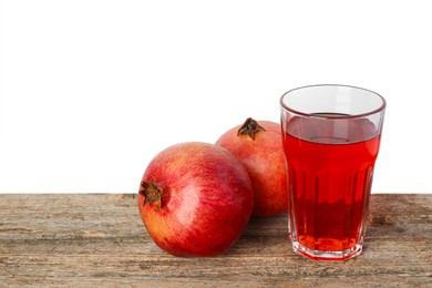 Photo of Refreshing pomegranate juice in glass and fruits on wooden table against white background. Space for text