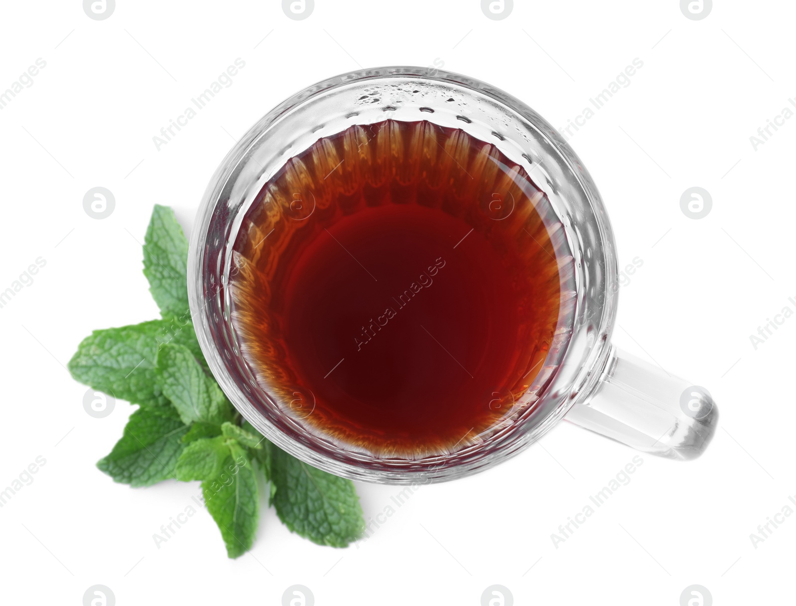 Photo of Cup with hot aromatic mint tea isolated on white, top view