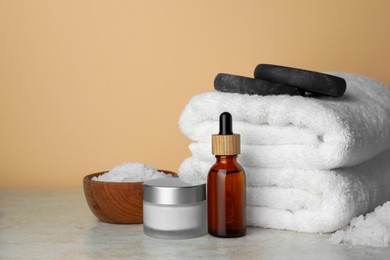 Composition with different spa products on beige table. Space for text