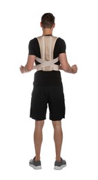 Photo of Man with orthopedic corset on white background, back view