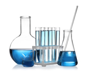 Photo of Set of laboratory glassware with blue liquid isolated on white