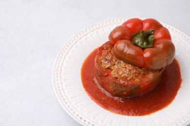 Photo of Delicious stuffed bell pepper on light table