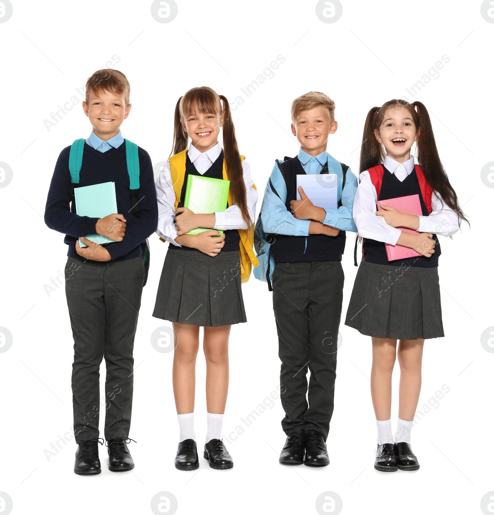 Photo of Little children in stylish school uniform on white background