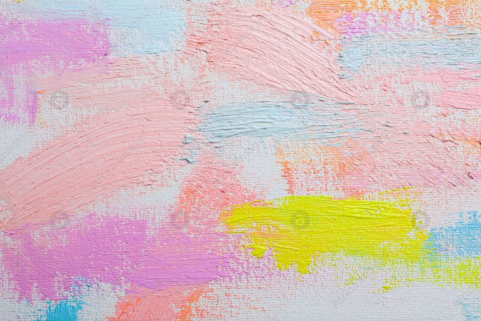 Photo of Strokes of different pastel acrylic paints on white canvas, closeup