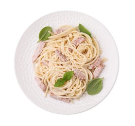 Plate of tasty pasta Carbonara with basil leaves isolated on white, top view