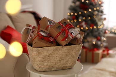 Basket full of gift boxes for Christmas advent calendar in room