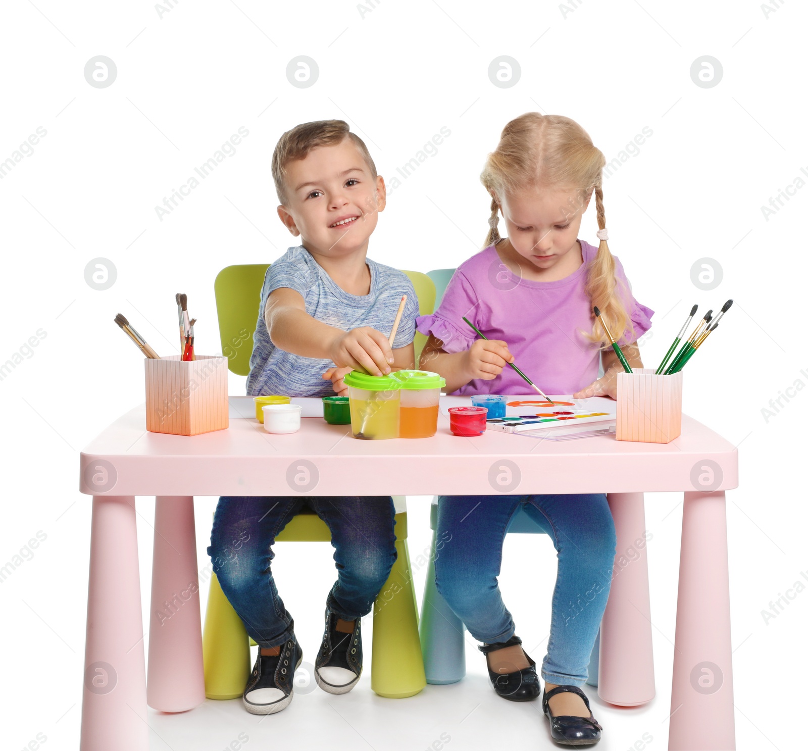 Photo of Cute children painting picture at table on white background