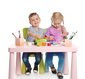 Cute children painting picture at table on white background