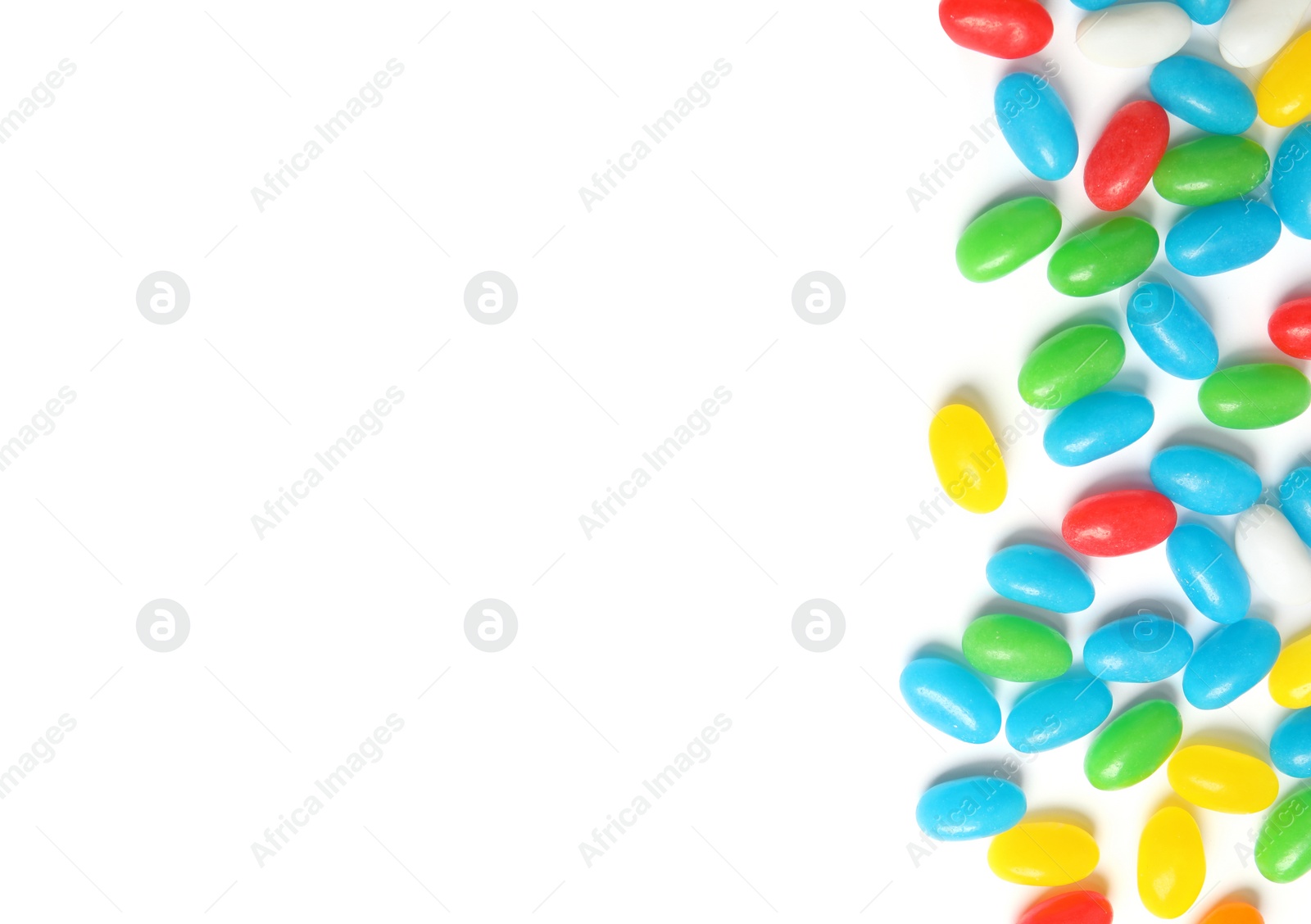 Photo of Colorful jelly beans on white background, top view