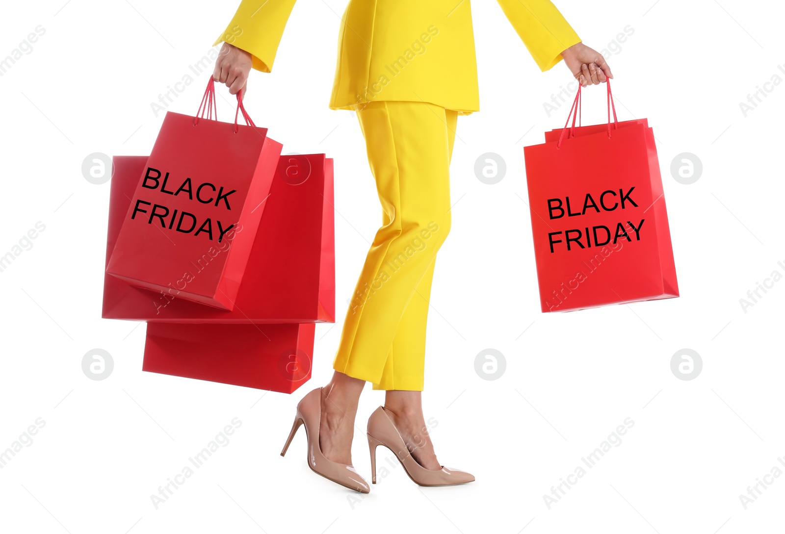 Photo of Woman with shopping bags on white background, closeup. Black Friday Sale