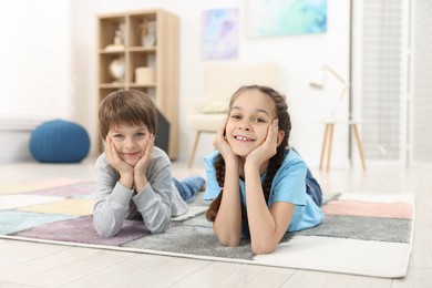 Happy brother and sister spending time together at home