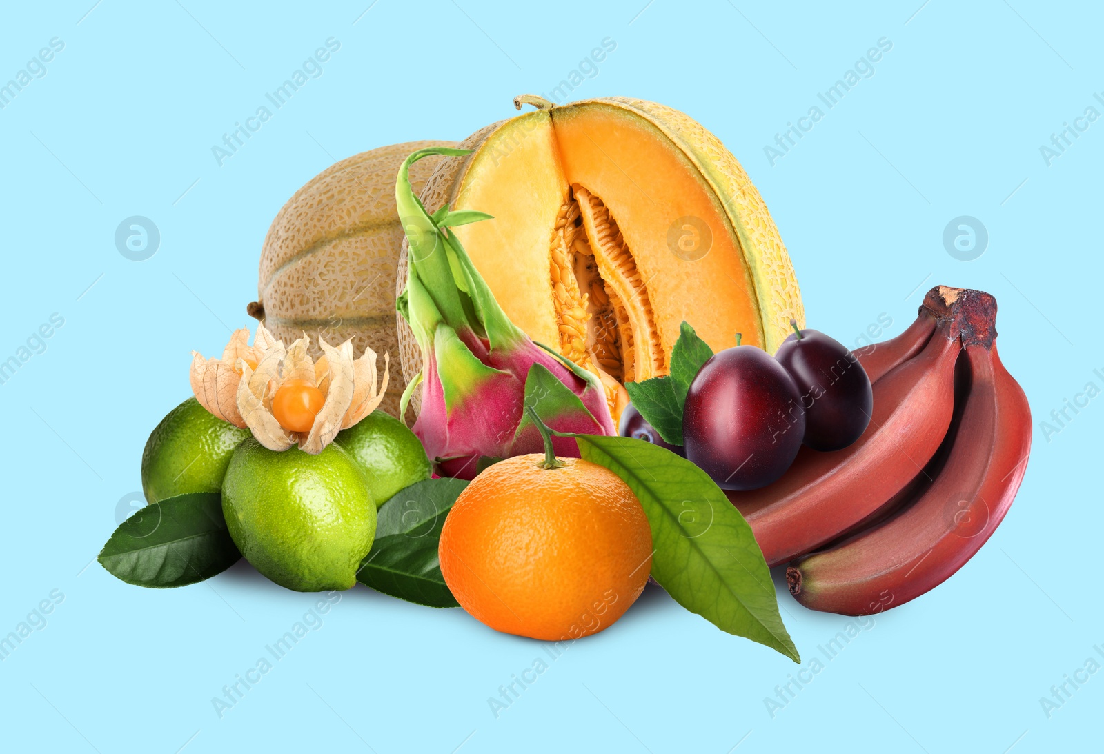 Image of Many different fresh fruits on light blue background