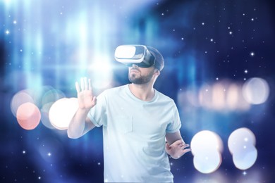 Image of Man using virtual reality headset and getting in simulated futuristic world 