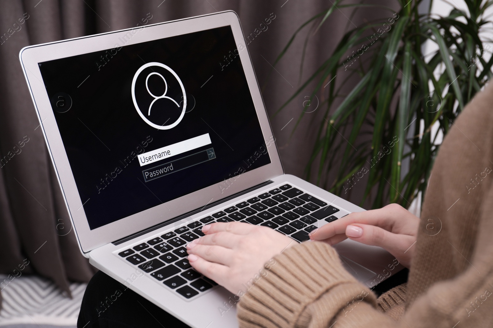 Photo of Woman unlocking laptop with blocked screen indoors, closeup