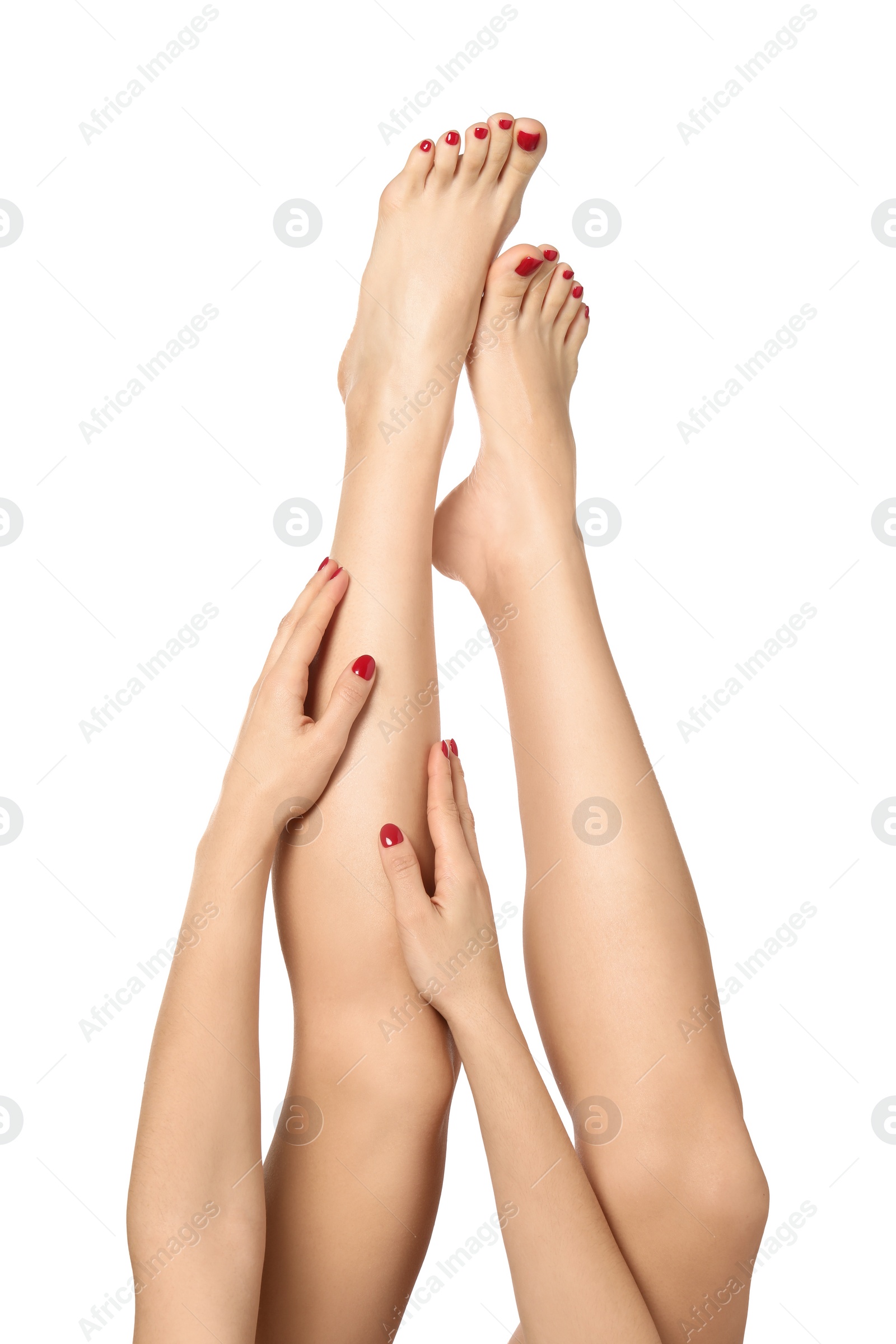 Photo of Woman with stylish red toenails after pedicure procedure isolated on white, closeup