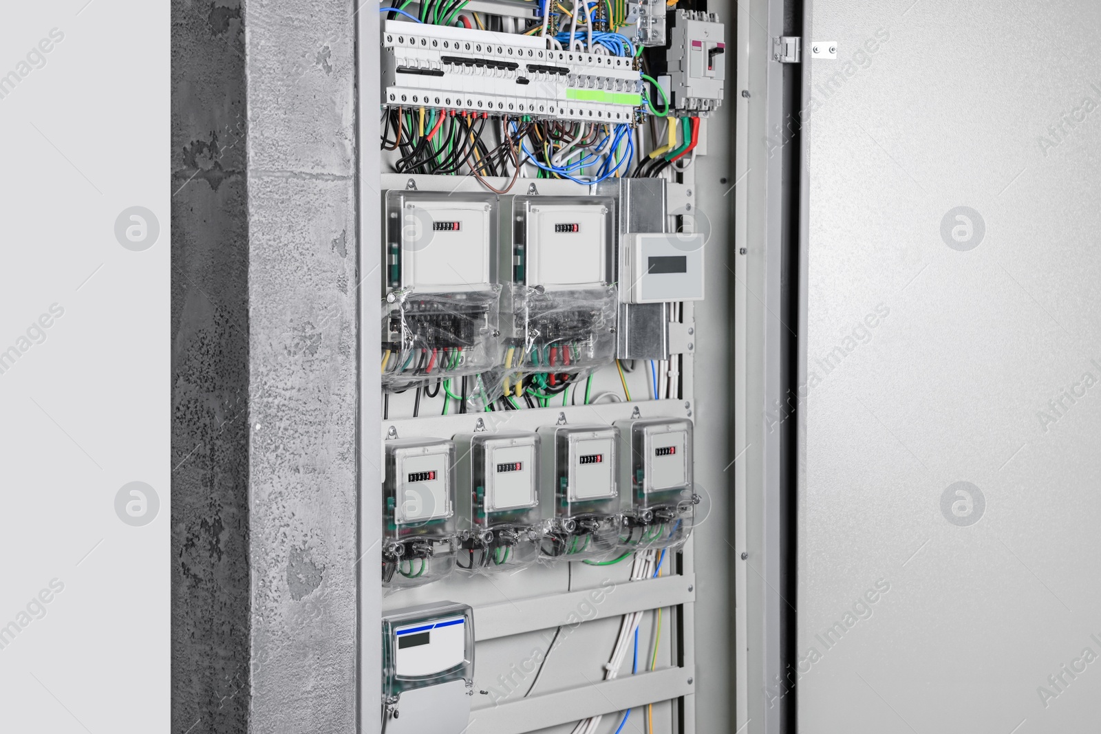 Photo of Fuse box with many electric meters and wires