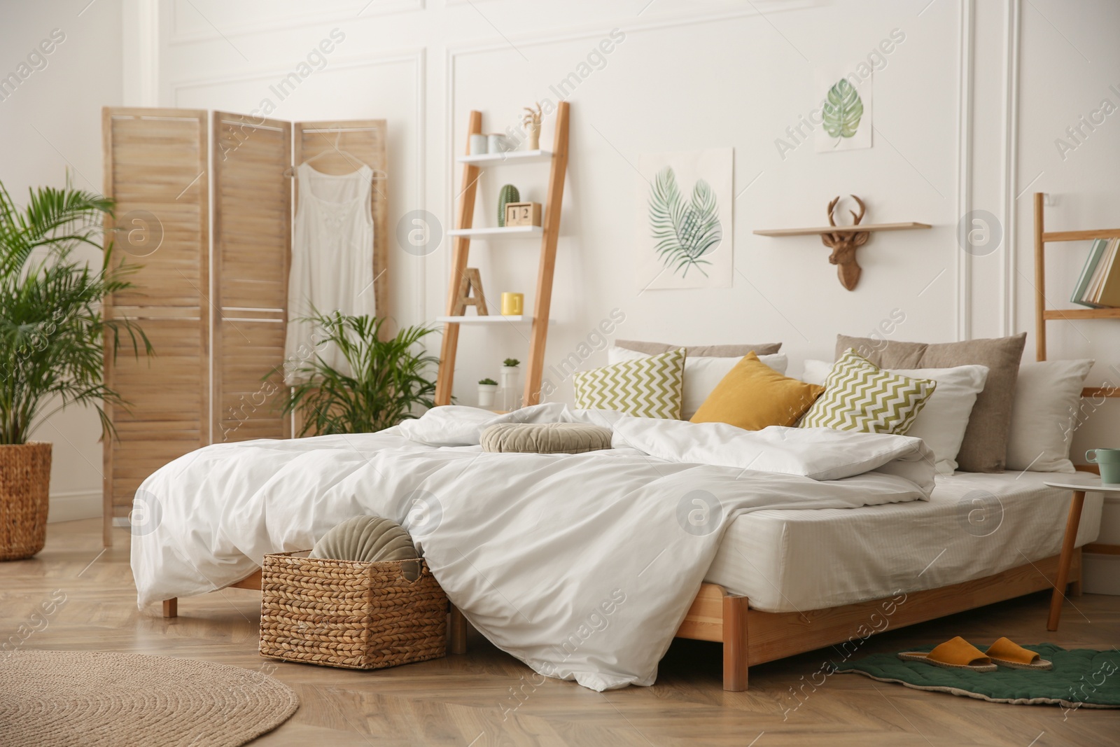 Photo of Modern bedroom with beautiful fresh house plants